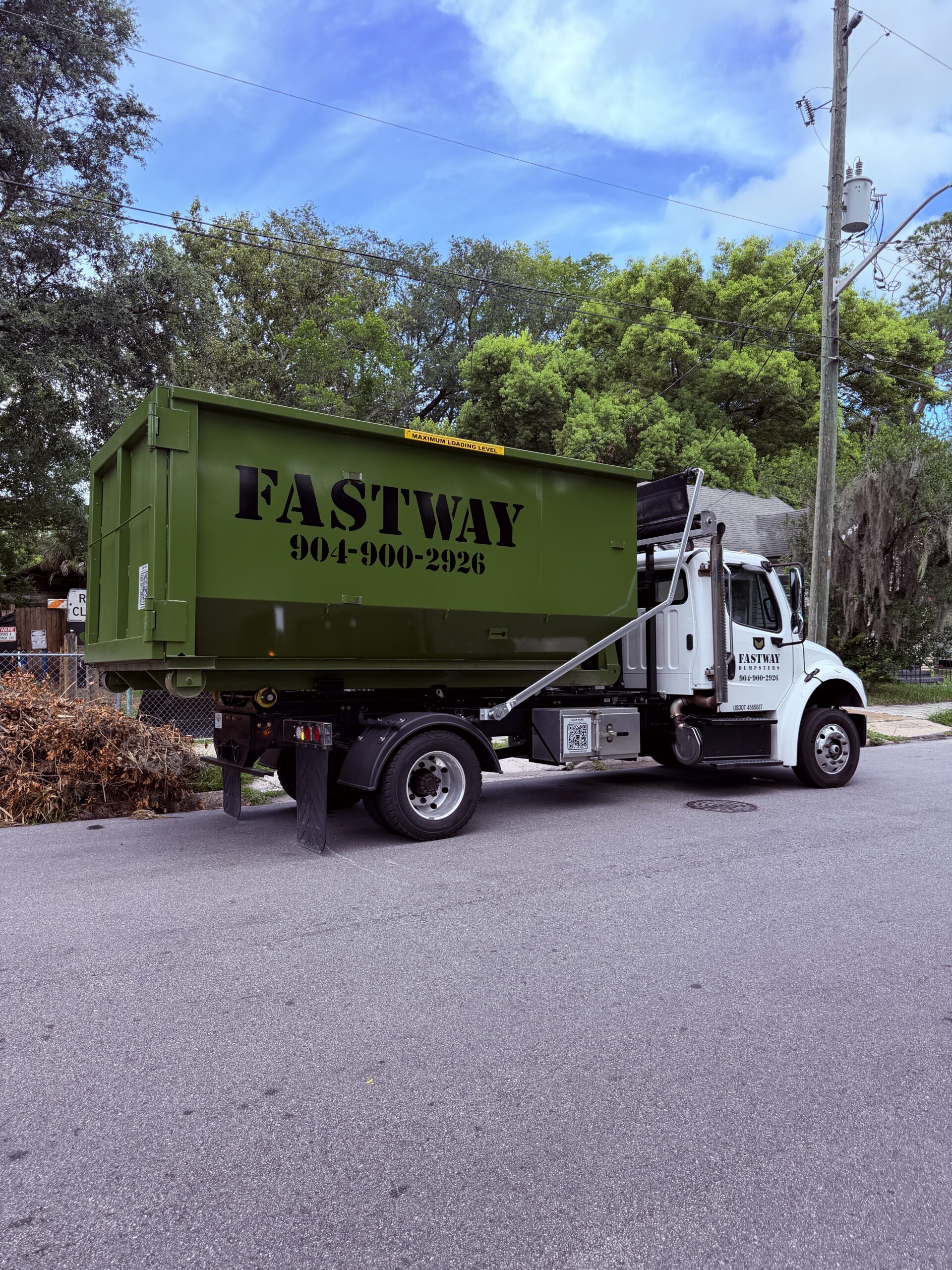 20-yard FastWay Dumpsters roll-off container on delivery truck in Jacksonville, Florida